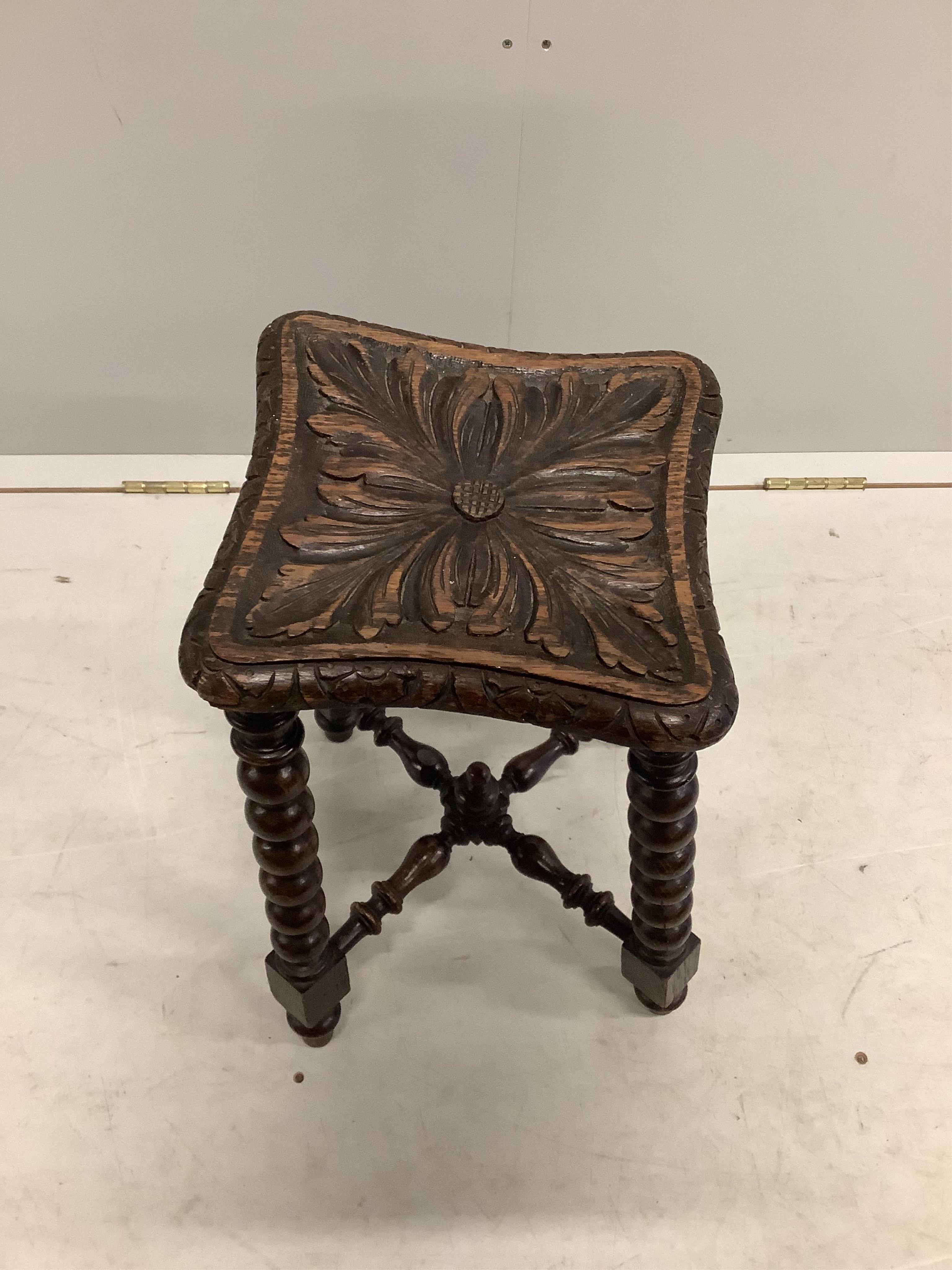 A Victorian carved oak bobbin turned stool, bears Bruce & Co. trade label, height 46cm. Condition - fair